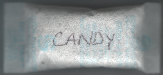 Do not eat this. Silica gel packet with 'candy' written on it.